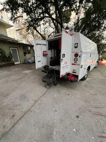 Magnet Plumbing service vehicle on-site for Grease Trap Cleaning in Naples